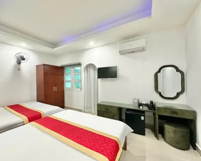 Standaard vierpersoonskamer — Phú Gia Hotel 464 Nguyễn Văn Linh